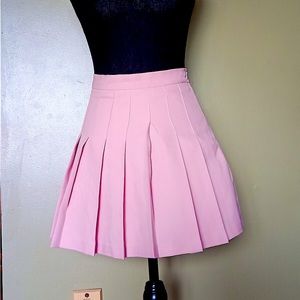 Pleaded pink mini skirt. Size small, got from value village.